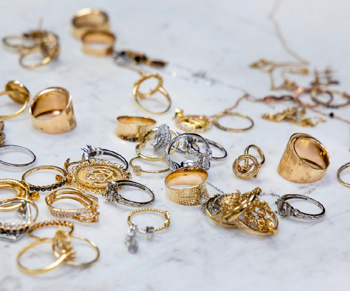 Mixed gold and silver jewellery pieces prepared for recycling and redesign